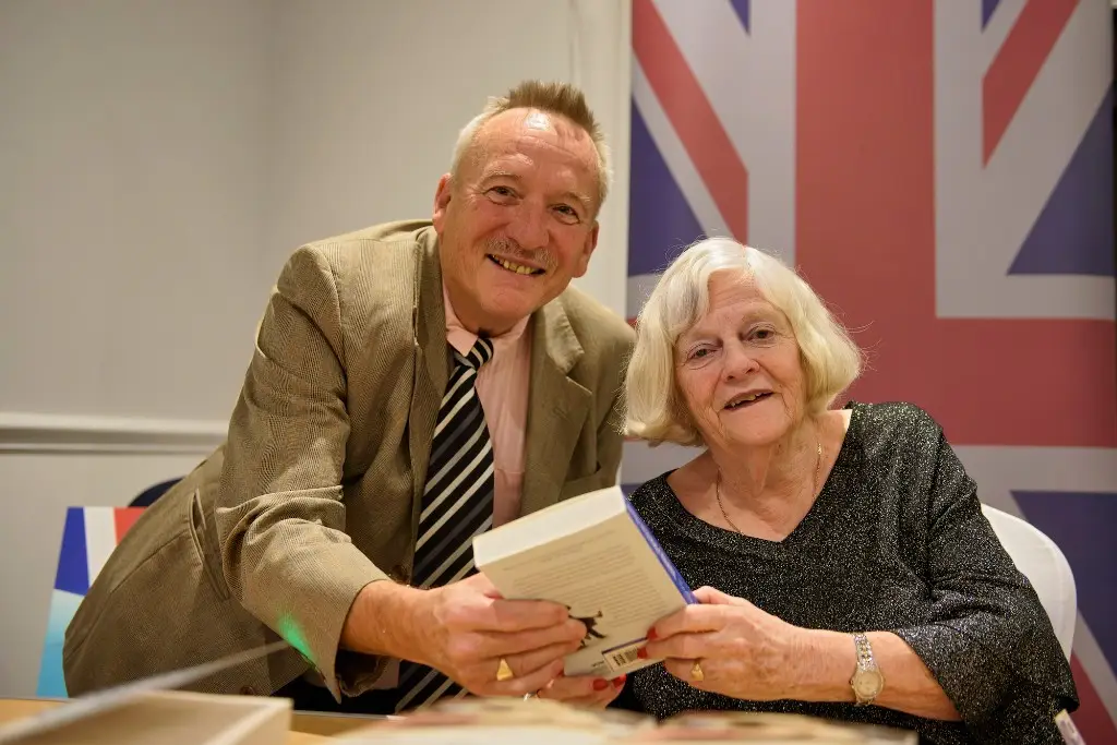 Ann signs her book for Paul
